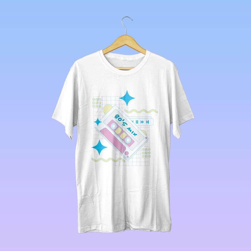 White t-shirt with retro pastel cassette design labeled "80's Mix," featuring colorful shapes. Background is a gradient of blue to purple.