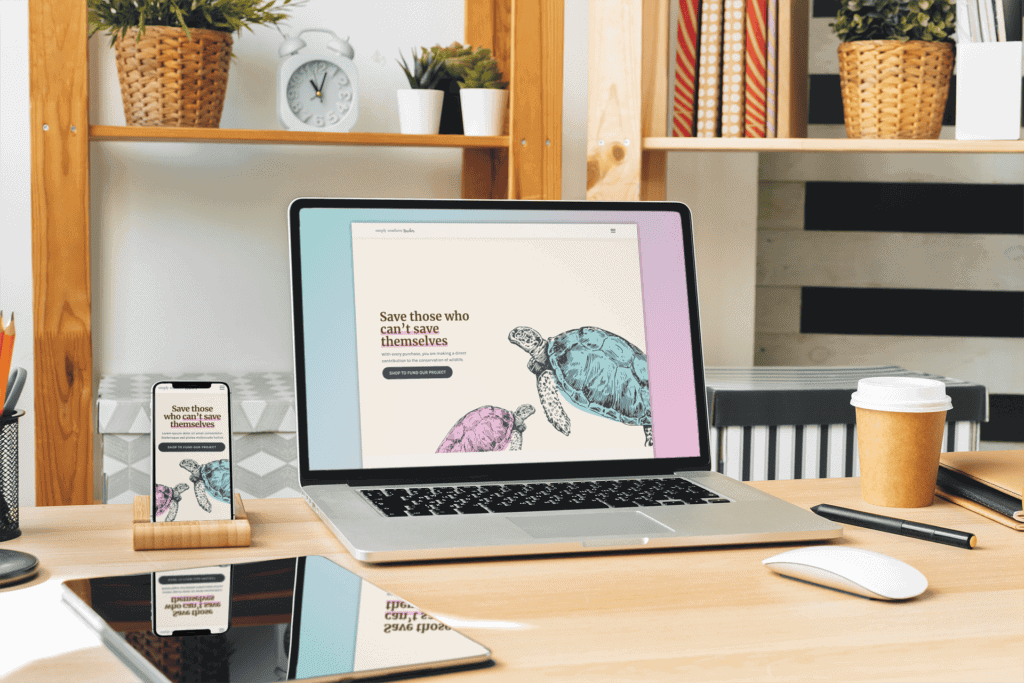 A cozy desk with a laptop showing a website featuring turtles and the text "Save those who can't save themselves." Nearby, a smartphone displays the same site.
